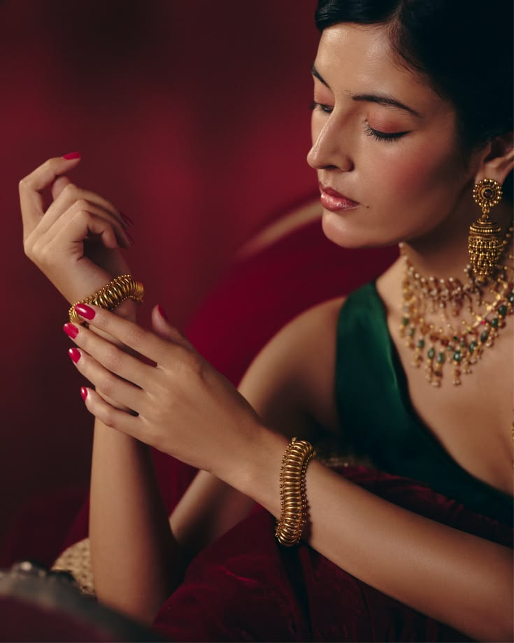 Woman wearing gold earrings and necklace